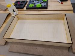 The box bottom being glued.