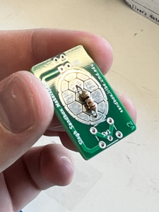 Insert the resistor into the holes on the PCB.