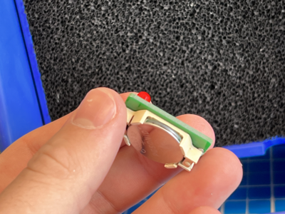 Place the battery in the holder